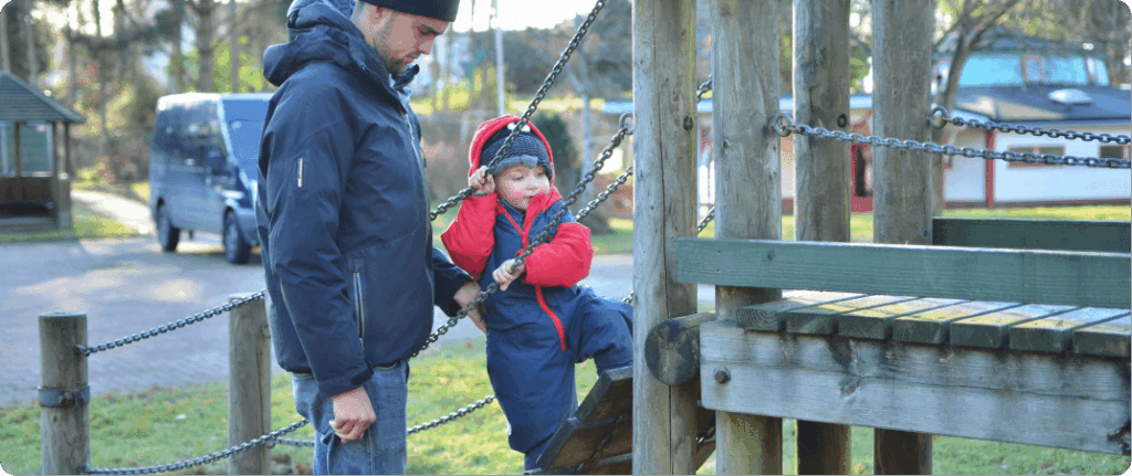 Confidence building activity - child challenging themself in the playground