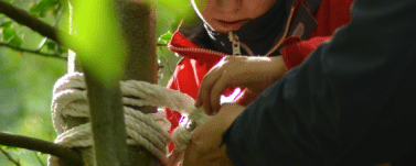 Child learning knots