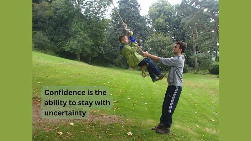 Confidence is the ability to stay with uncertainty – adult with child on a rope swing