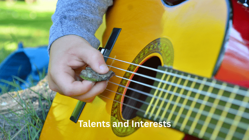 Talents and Interests – child playing a guitar outside 