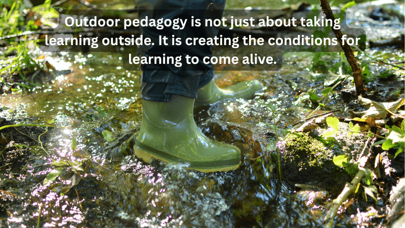child’s wellingtons in rushing water
