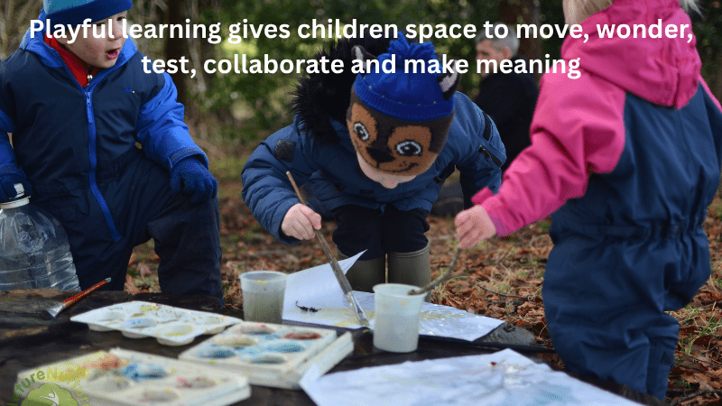 group of children painting outside